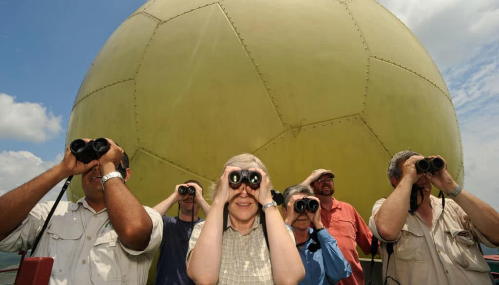 Birders on top of Canopy Tower looking through binoculars